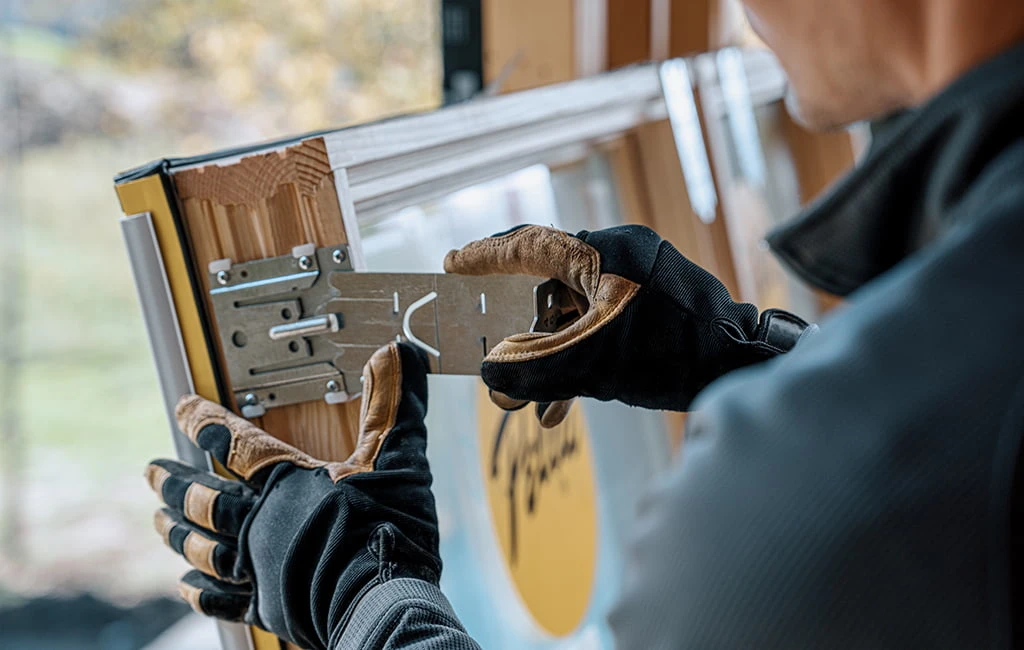 Professional working on window frame